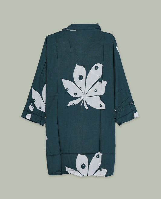 Dark green printed shirt top featuring a spread collar, button-down front, and three-quarter sleeves with cuff detail, finished in a relaxed longline fit.