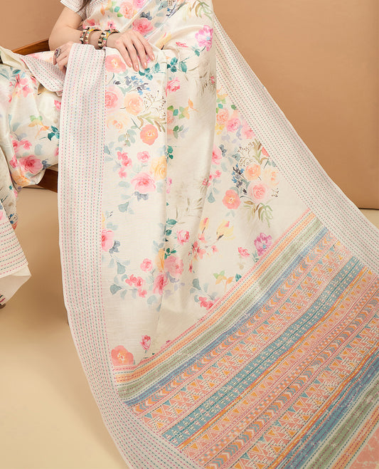Cream toned semi tussar saree featuring delicate multicolour floral prints on the body, accented with a pastel hued Katha style stitched border and blue & yellow printed pallu Comes with a matching floral printed blouse for a graceful look.