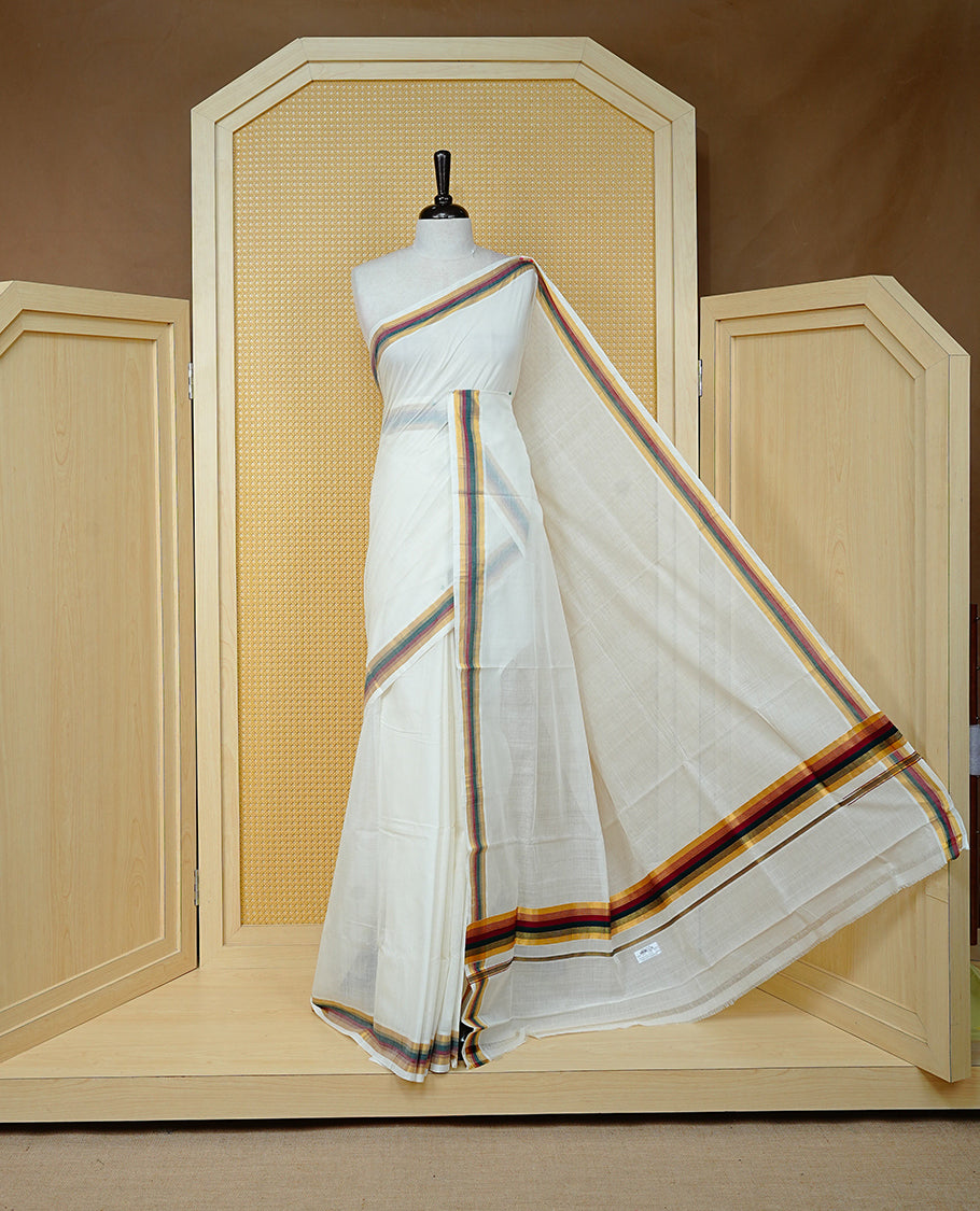 Cream colour Cotton kerala saree featuring Classy Plain body, complemented by Gold with Maroon & Green zari border & Pallu, paired with matching blouse piece.