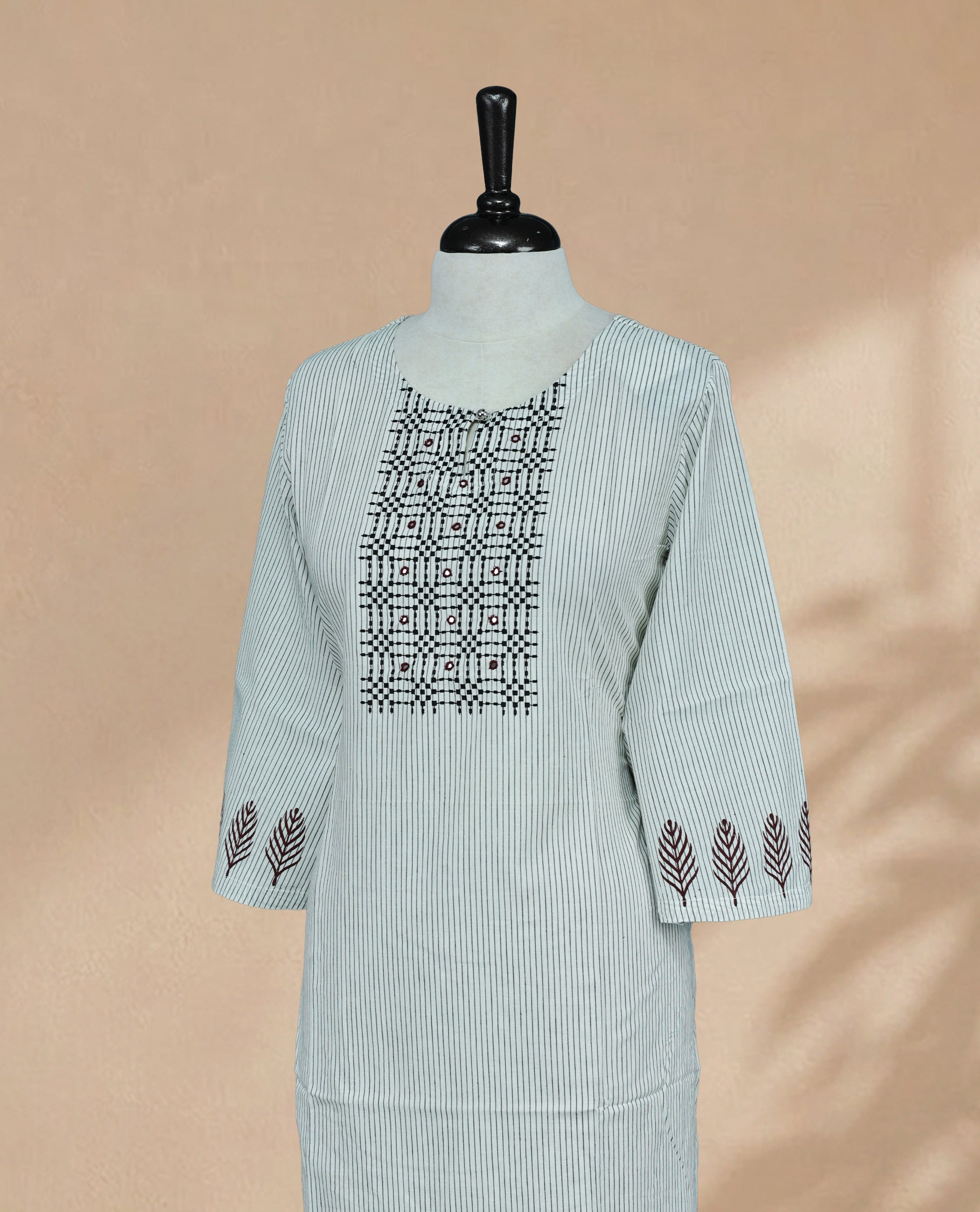 Off White Colour Kurti featuring fine vertical stripe On Body , a round neckline with intricate Box Design Print & Mirror Work , 3/4 sleeves Design