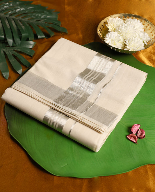 Classic off white colour pure handloom cotton double dhoti featuring an elegant silver zari border and a blend of comfort and tradition, perfect for weddings, temple visits, and cultural celebrations.