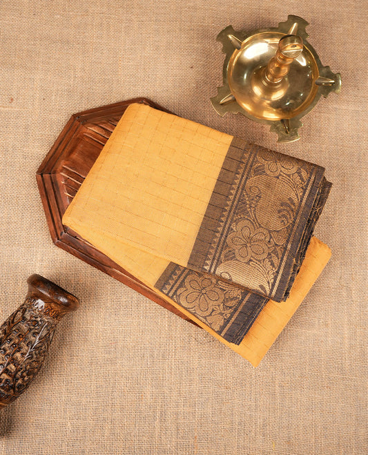 Yellow colour sungudi cotton saree featuring gold zari check pattern across body, contrast colour with gold zari floral kodi pattern on border, without blouse piece.