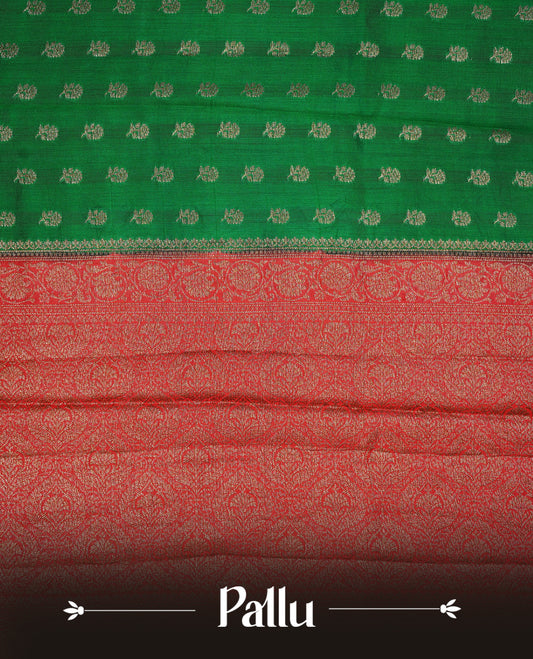 Green colour Banaras tussar silk saree featuring elegant gold zari buttas across the body, complemented by a contrast Red border with rich zari detailing. Comes paired with a matching blouse piece.