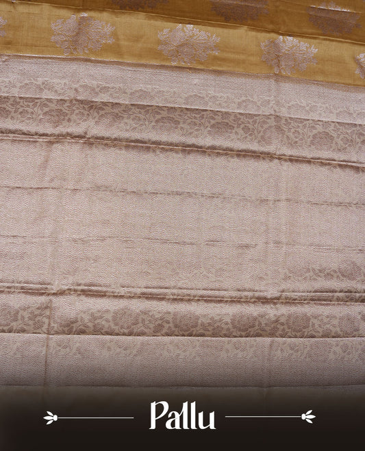 Olive colour pure banaras tusser silk saree highlighting antique zari pattern across body, with contrast cream colour with zari border and paired with matching blouse