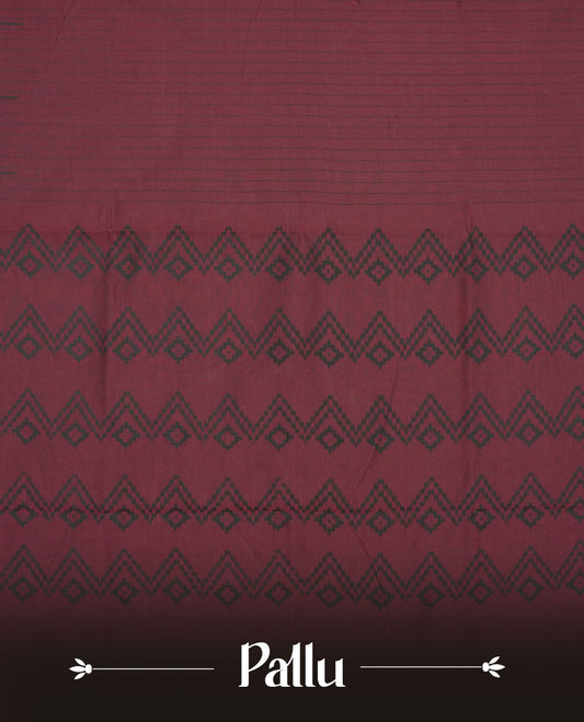 Dark Maroon colour poly cotton saree with black vertical dotted line pattern on the body, paired with a matching pallu featuring black zigzag geometric border, and a coordinated all‑over black stylised fleur‑de‑lis printed blouse piece.