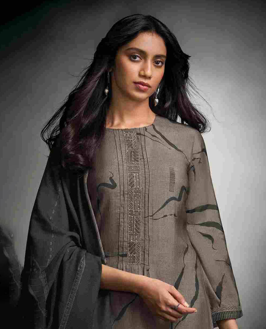 Grey brown colour suit material with pakiza silk digital print top with embroidery worked sleeve, paired with matching satin bottom and contrast colour pakiza light weight print with embroidery lace dupatta.