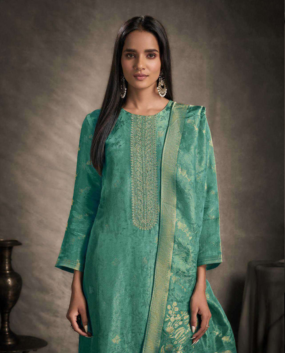 Aqua green colour suit material featuring an Akina silk jacquard top with delicate embroidery, paired with satin bottoms and completed with a matching Akina silk jacquard dupatta