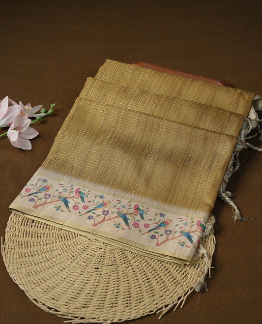 Olive colour tussar saree featuring golden zari dot stripped pattern on the body, complemented by a contrast cream colour mutlicolour floral kodi & animal print on border & pallu, paired with a matching blouse.