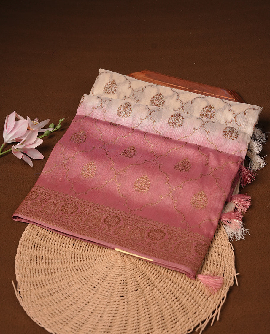 Cream colour semi tussar Banarasi saree featuring Antique zari motifs on body, Paired bya contrast dusty pink colour border, and a matching blouse piece.