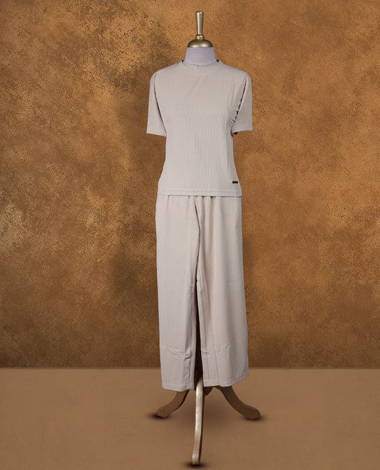 Cream colour coord set styled with a T shirt design with short sleeve, pair a matching bottom pant .