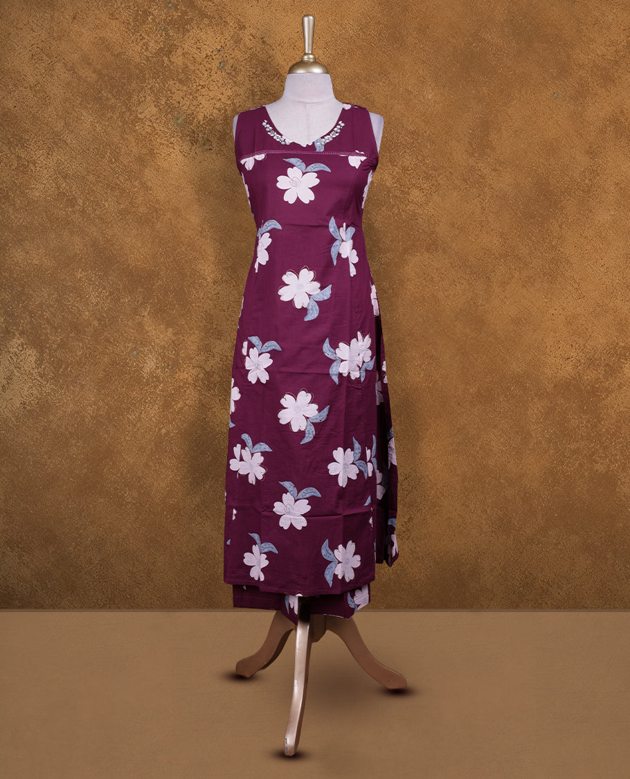 Plum colour coord set sleeveless floral kurta featuring a scoop neckline with subtle bead embellishments, all-over contrast floral print, a straight knee-length silhouette, and side slits for a comfortable, elegant fit.