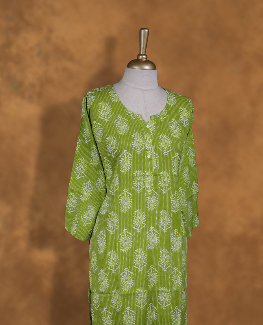 Green colour kurti adorned with white floral prints & dot stripes, featuring a round neckline with button placket and comfy 3/4th sleeves.