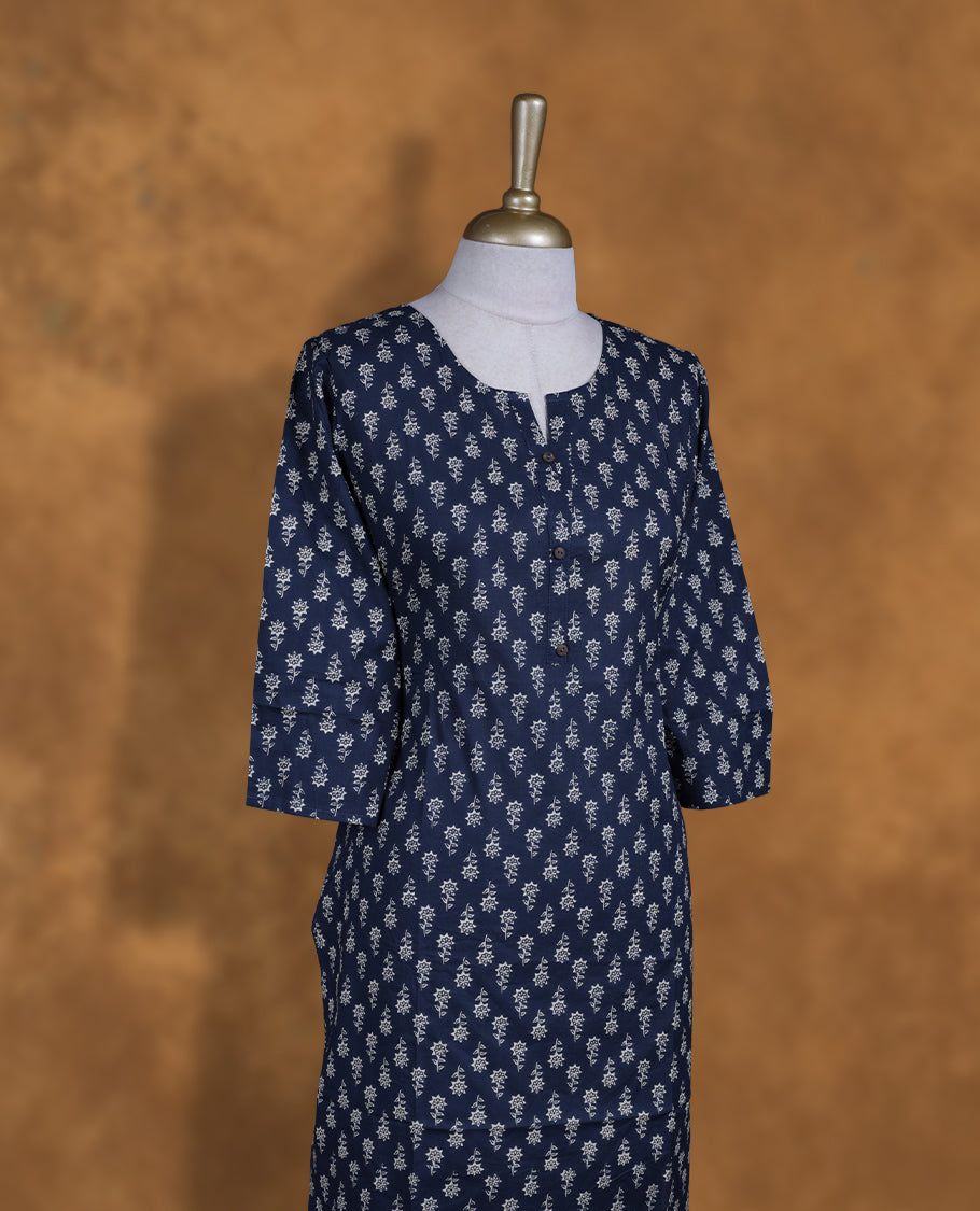 Dark blue colour kurti adorned with white floral prints, featuring a round neckline with button placket and comfy 3/4th sleeves.