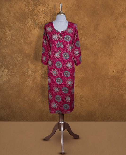 Rani pink colour kurti with styled with a round with v split neckline, print pattern across body knee length design, and a sleeve .