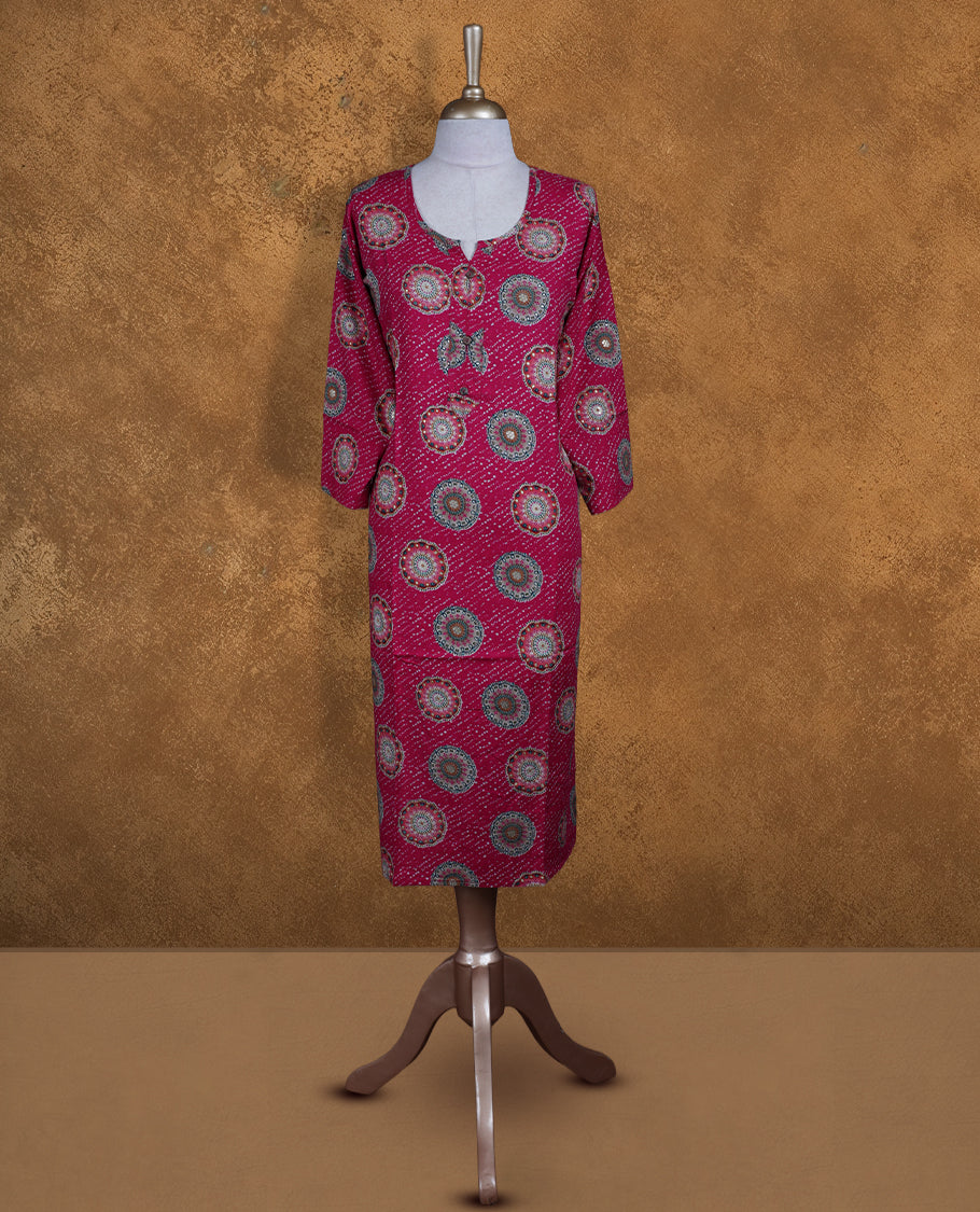 Rani pink colour kurti with styled with a round with v split neckline, print pattern across body knee length design, and a sleeve .
