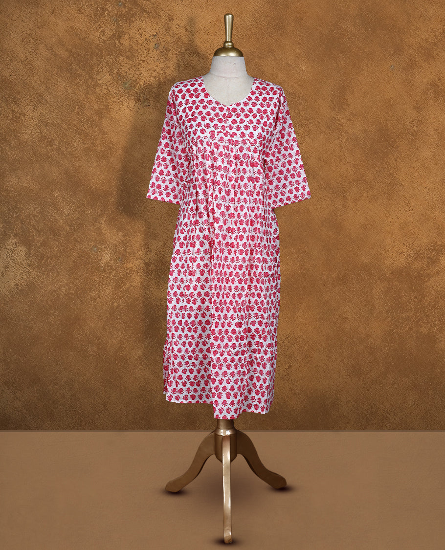 White colour Kurti featuring  pink floral print pattern across,  round neckline with botton detail, and sleeves,