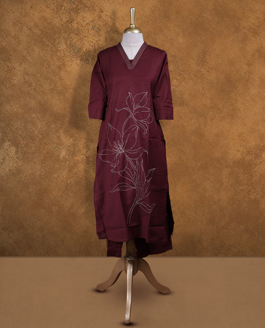 Maroon colour coord set by Vismay with styled with a V with thread embroidery on neckline & sleeve,floral thread pattern on body, knee length design, with matching bottom .