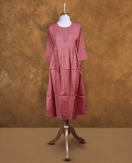 Peach colour kurti with white stone pattern, knee length design, styled with a Round neckline and a  sleeve .