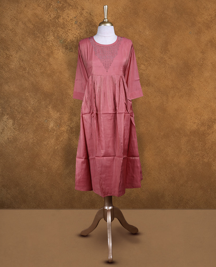 Peach colour kurti with white stone pattern, knee length design, styled with a Round neckline and a  sleeve .