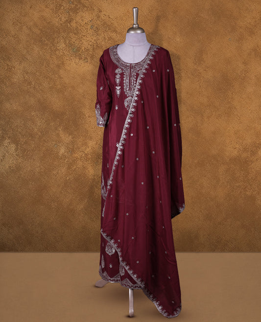 Dark red colour sharara set featuring gold colour thread and beats embroidered neckline, sleeves, and thread embroidery on body , Paired with a matching dupatta