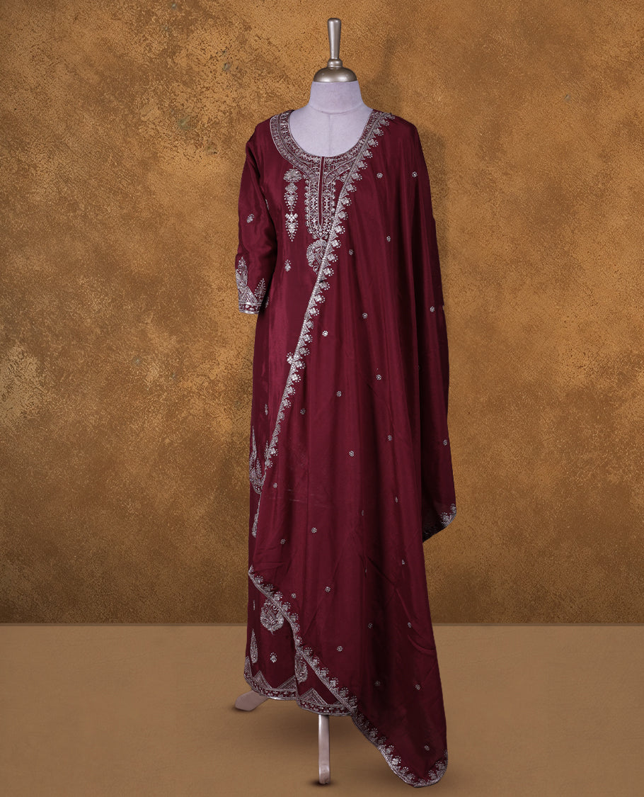Dark red colour sharara set featuring gold colour thread and beats embroidered neckline, sleeves, and thread embroidery on body , Paired with a matching dupatta