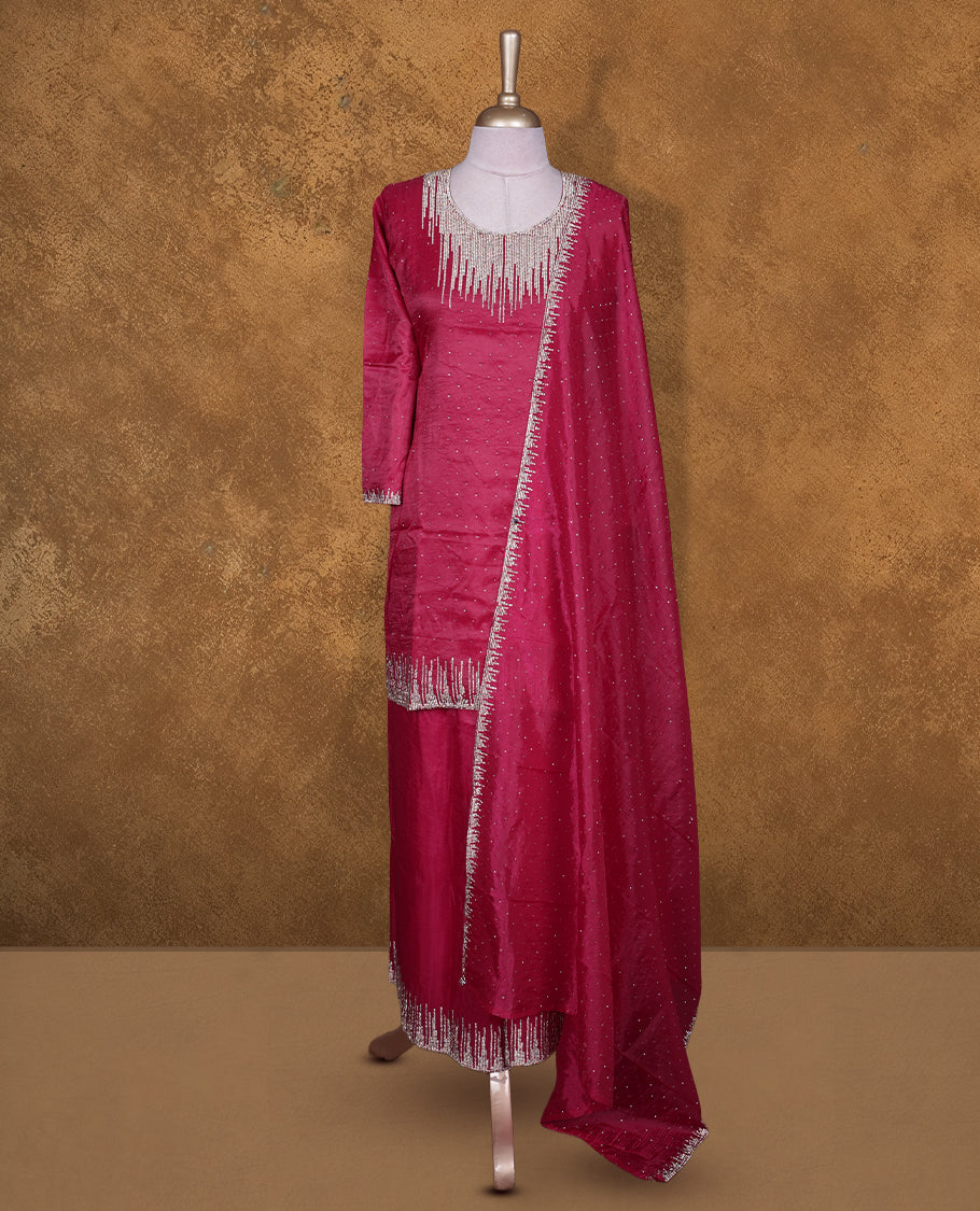 Rani pink colour sharara set featuring gold stone pattern neckline, sleeves, and stone pattern across on body , Paired with a matching dupatta