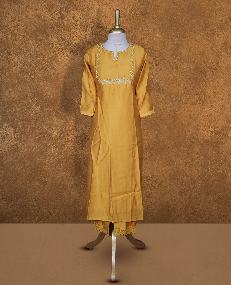 Yellow colour coord setwith styled with a thread & beats pattern around neckline & sleeve, knee length design .