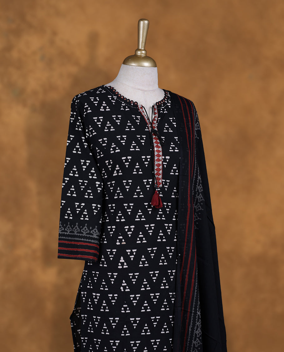 Black colour churidar set featuring thread embroidered on neckline, sleeves, and Geometeric printed pattern on body , Paired with a matching dupatta