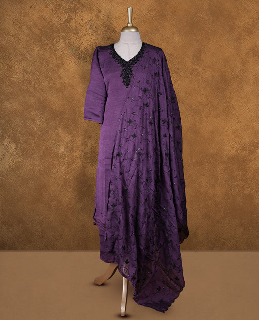 Purple colour churidar set featuring V neckline, three‑fourth sleeves, and tonal bead and thread embellishment along neckline and body, paired with a matching embroidered dupatta.