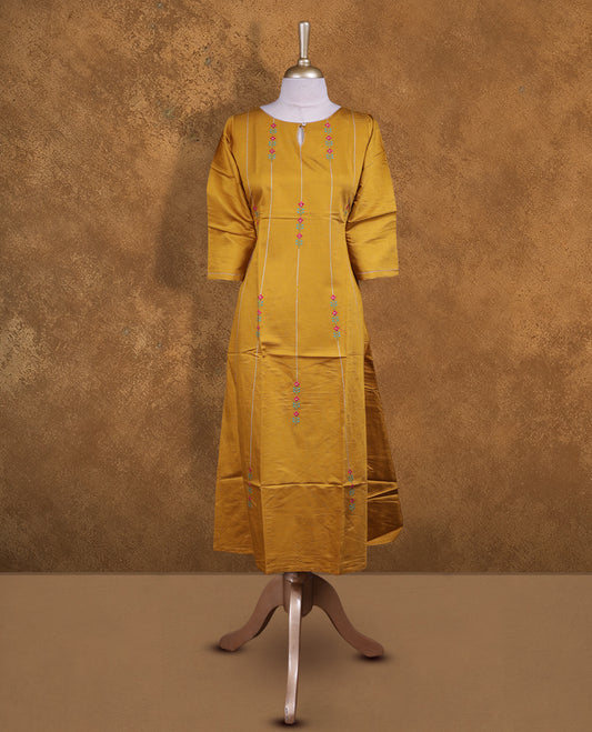 Mustard colour kurti with styled with a thread pattern around neckline & across body, knee length design, and a sleeve .