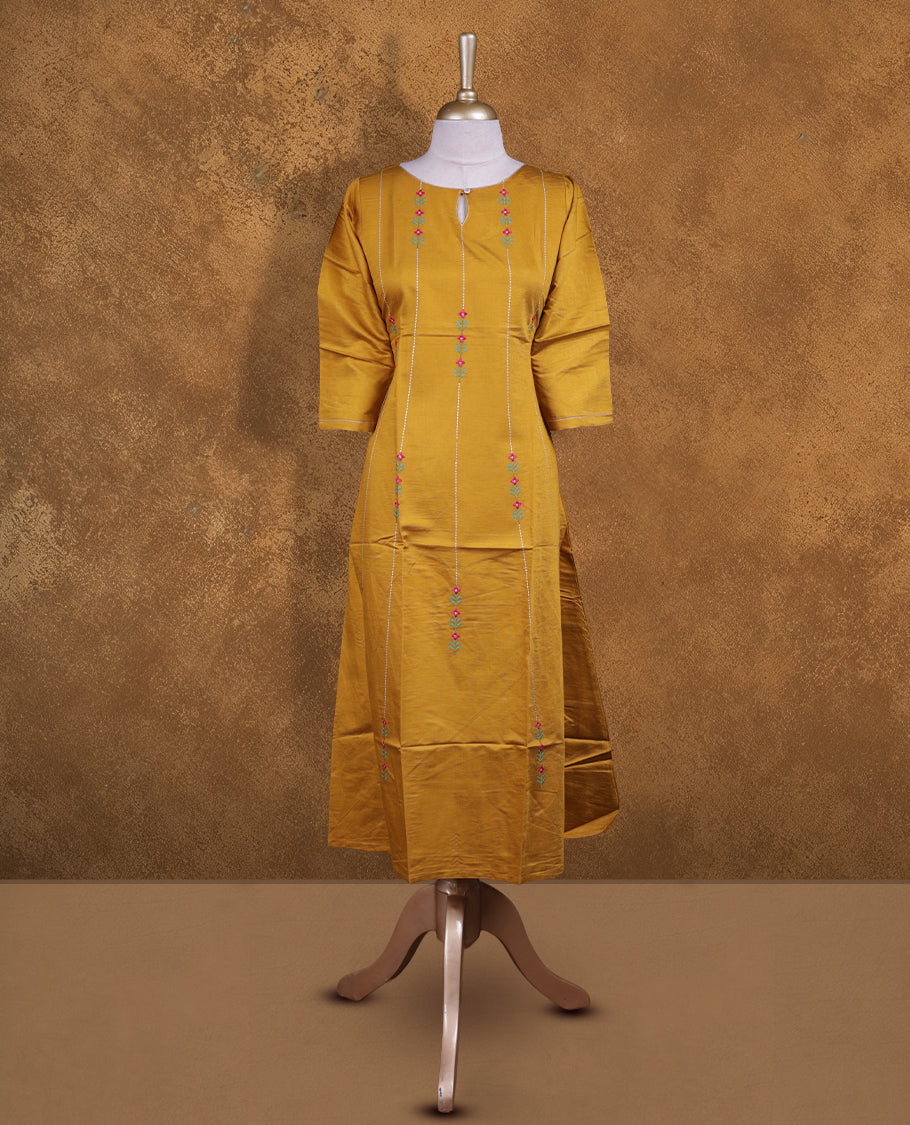 Mustard colour kurti with styled with a thread pattern around neckline & across body, knee length design, and a sleeve .