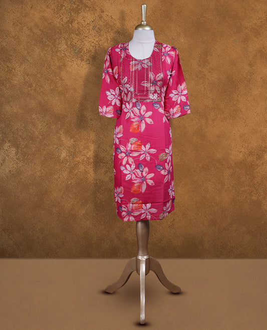 Rani pink colour kurti with styled with a thread pattern around neckline & Floral print across body, knee length design, and a sleeve .