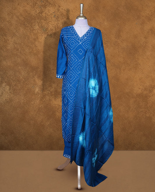 Blue colour churidar set featuring white pattern across body and v neckline, with matching bottom and dupatta.