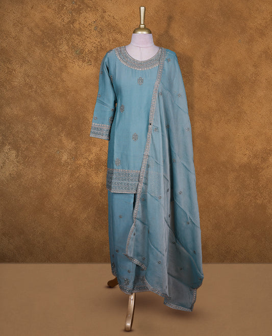 Dusty blue colour sharara set featuring gold colour stone worked on neckline, sleeves, and stone scattered pattern on body , Paired with a matching dupatta