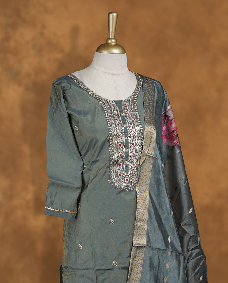 Olive green colour churidar set featuring thread and cut beats embroidered neckline, sleeves, and Gold colour motifs on body , Paired with a matching dupatta