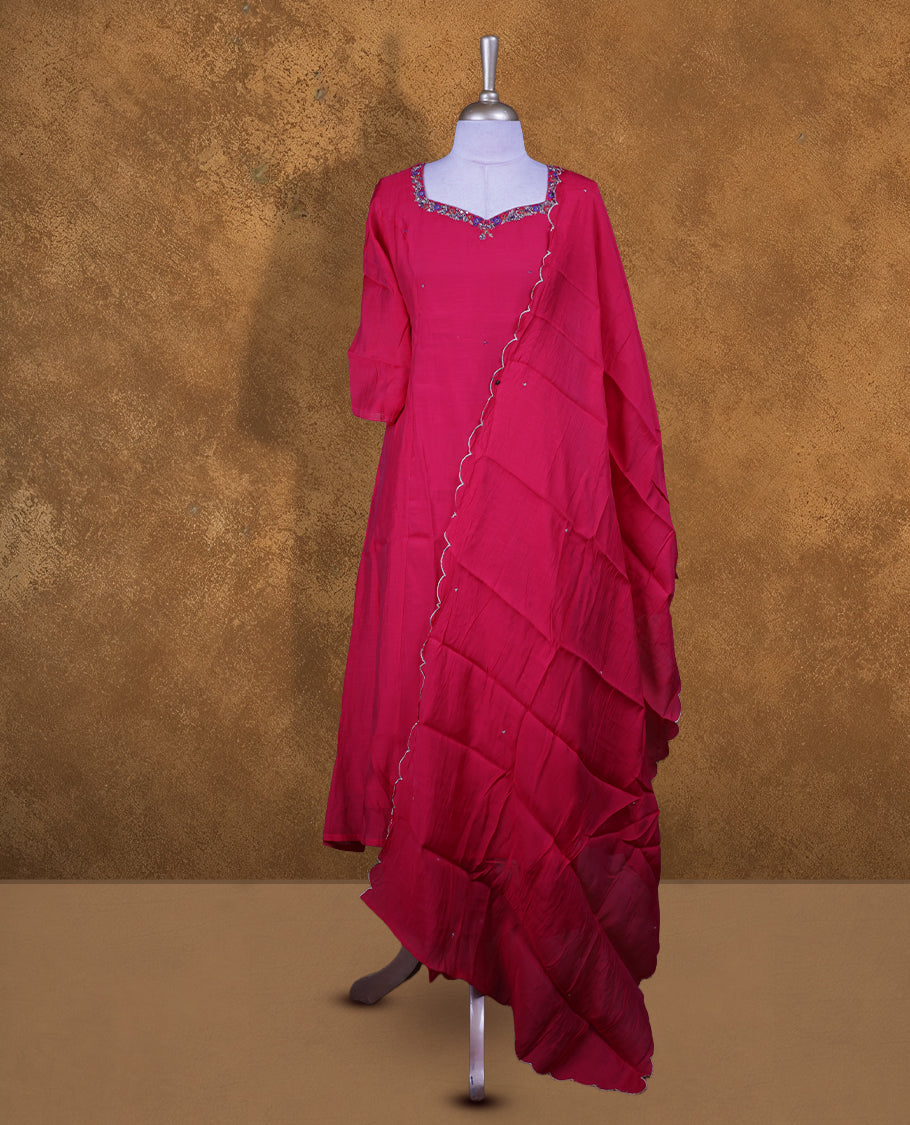 Red colour churidar set featuring a richly embellished sweetheart neckline with contrast thread and sequin detailing, paired with a matching ruffled dupatta.