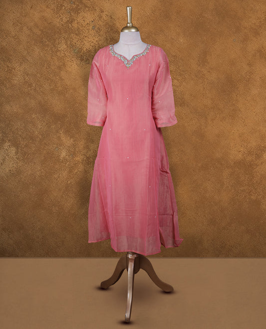 Peach and gold double shade colour kurti with styled with a thread & beats pattern around neckline,  knee length design, and a sleeve .