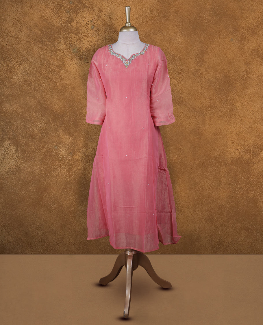 Peach and gold double shade colour kurti with styled with a thread & beats pattern around neckline,  knee length design, and a sleeve .