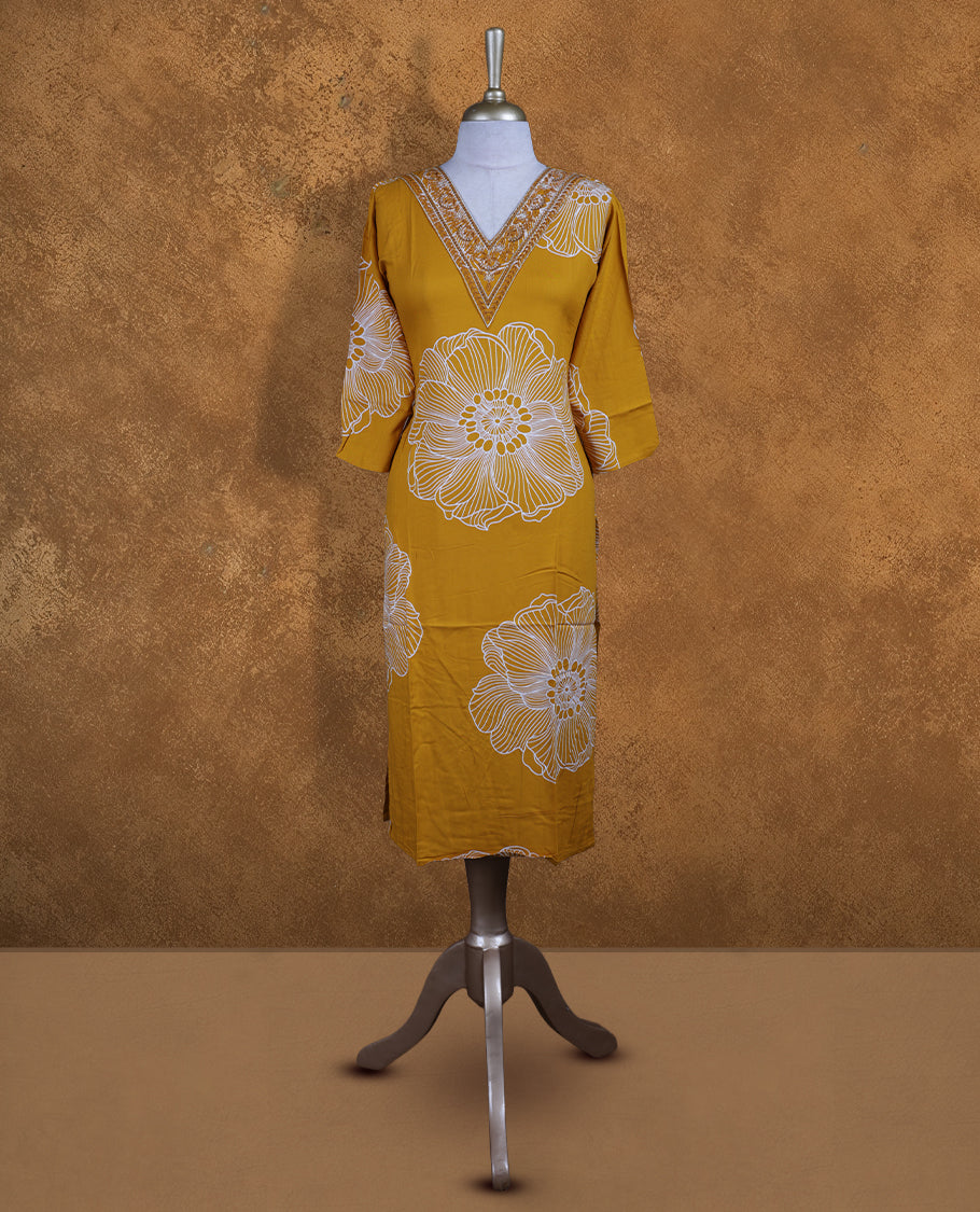 Yellow colour kurti with styled with a thread & beats pattern around neckline & white pattern across body, knee length design, and a sleeve .