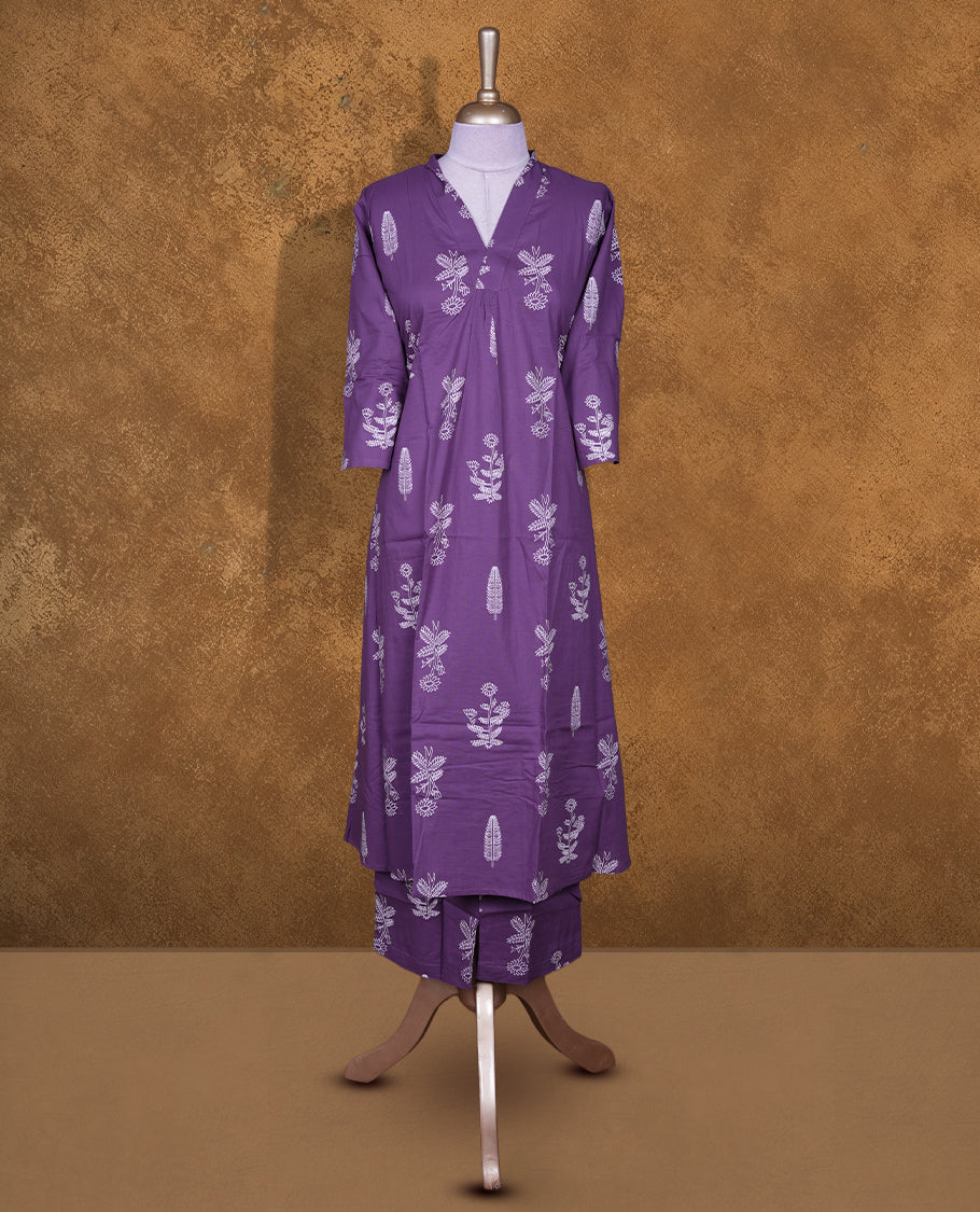Purple colour coord set featuring cream colour floral pattern across body with v neckline and matching pant.