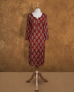 Brown colour Kurti featuring floral print pattern across,  round neckline with split, and sleeves.