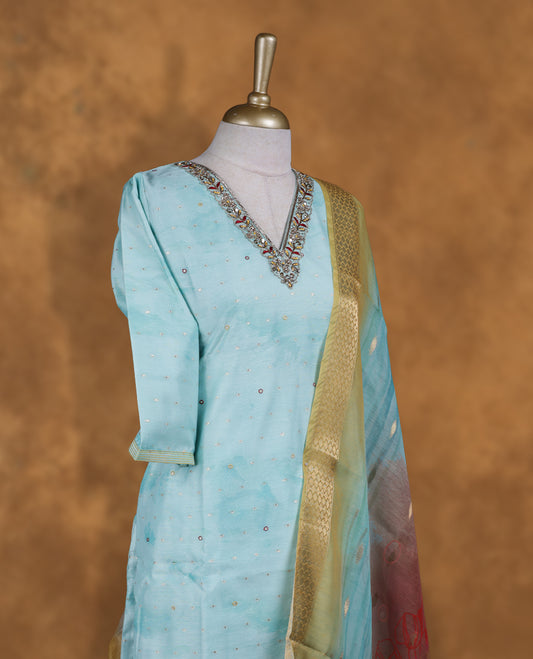 Light blue colour churidar set featuring thread and cut beats embroidered neckline, sleeves, and Gold colour motifs on body , Paired with a matching dupatta