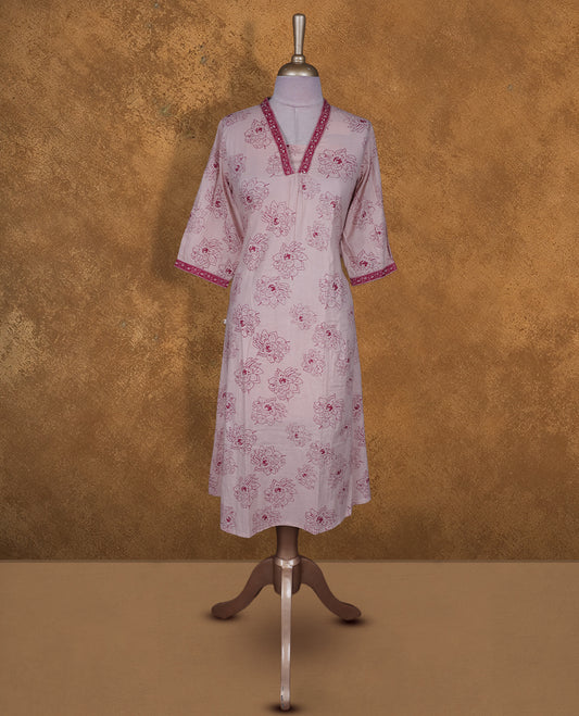 Baby pink colour kurti By Vismay styled with a thread pattern around neckline, print pattern across body knee length design, and a sleeve .