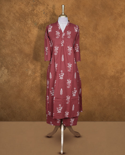 Brown colour kurta set featuring an elegant V-neckline, all-over white floral motifs, three-quarter sleeves, and a straight-fit kurta paired with a matching bottom for effortless everyday style.