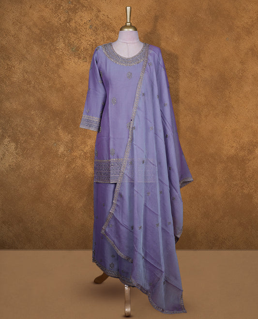 Lavender colour sharara set featuring gold colour stone worked on neckline, sleeves, and stone scattered pattern on body , Paired with a matching dupatta