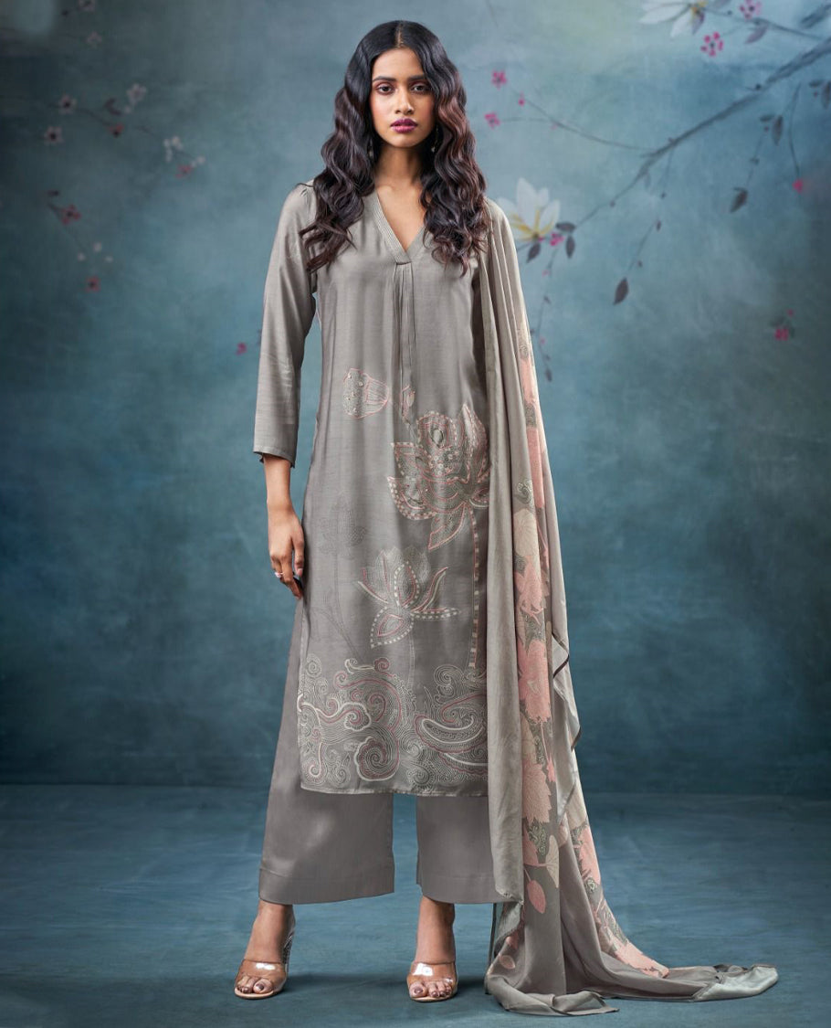 Gray colour suit material with pakiza silk printed top featuring subtle embroidery on the body, paired with matching bottom and lightweight printed dupatta. (Copy)