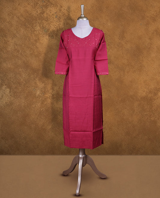 Red colour kurti with styled with a thread & beats pattern around neckline, knee length design, and a sleeve .