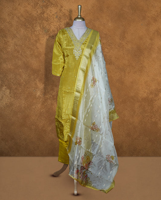 Lemon colour churidar set featuring beats and thread embroidery on v neckline and matching dupatta and pant.