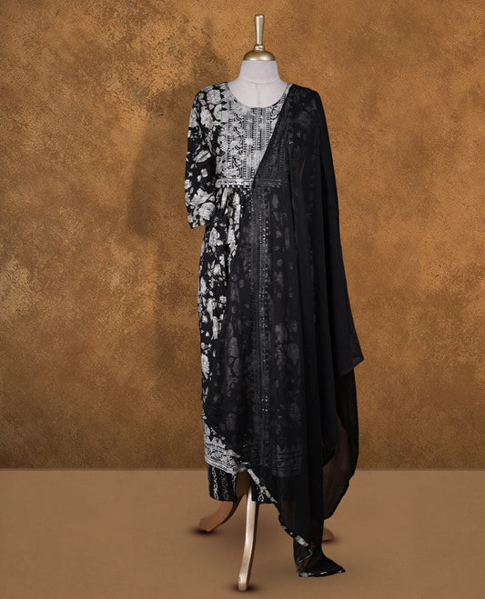 Black colour churidar set featuring thread embroidered pattern neckline, sleeves, and floral print across body , Paired with a matching dupatta