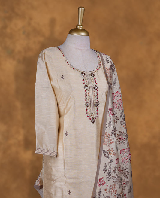 Beige colour churidar set featuring thread and cut beats embroidered neckline, sleeves, and thread embroidery on body , Paired with a matching dupatta